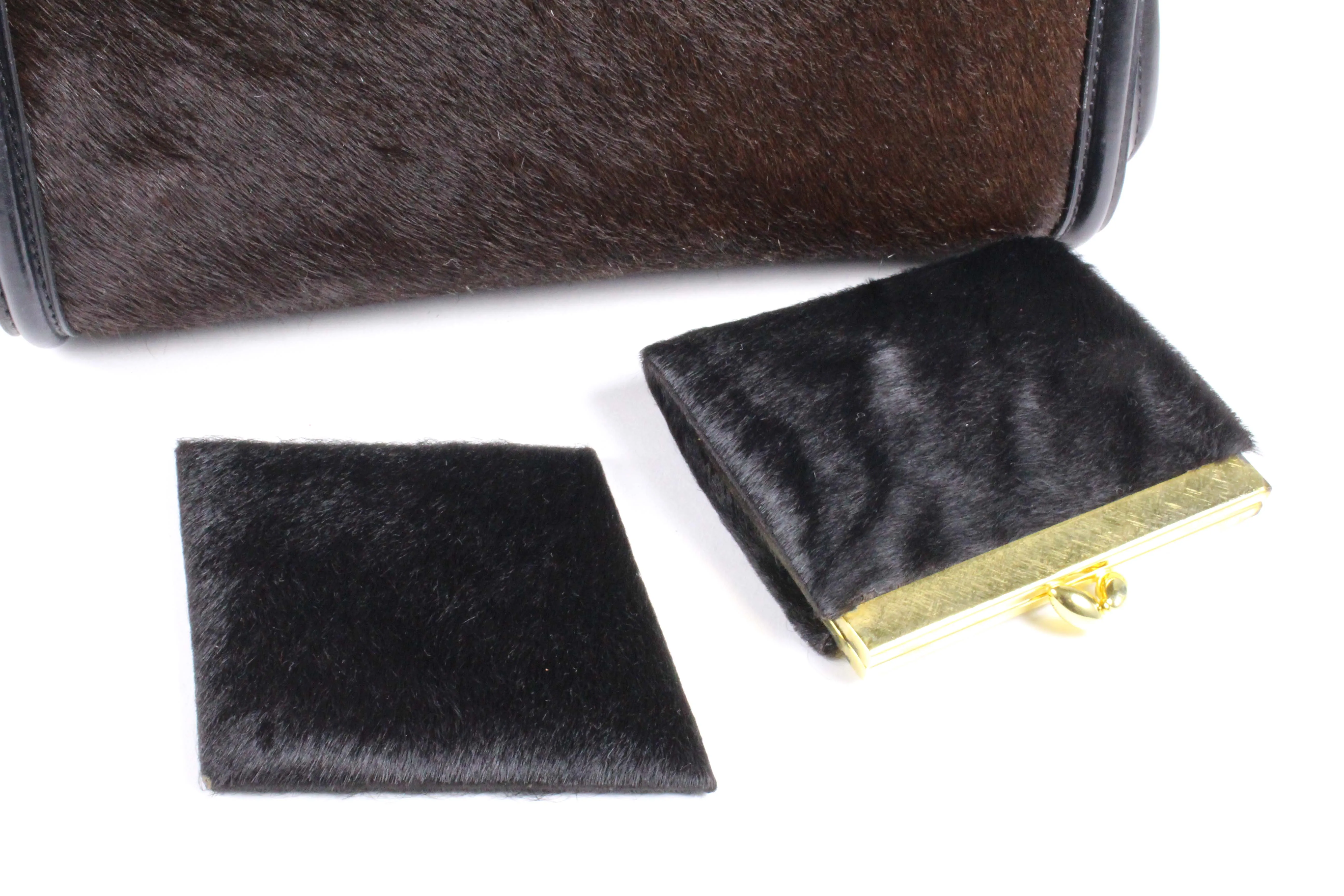 Black leather and brown fur frame handbag