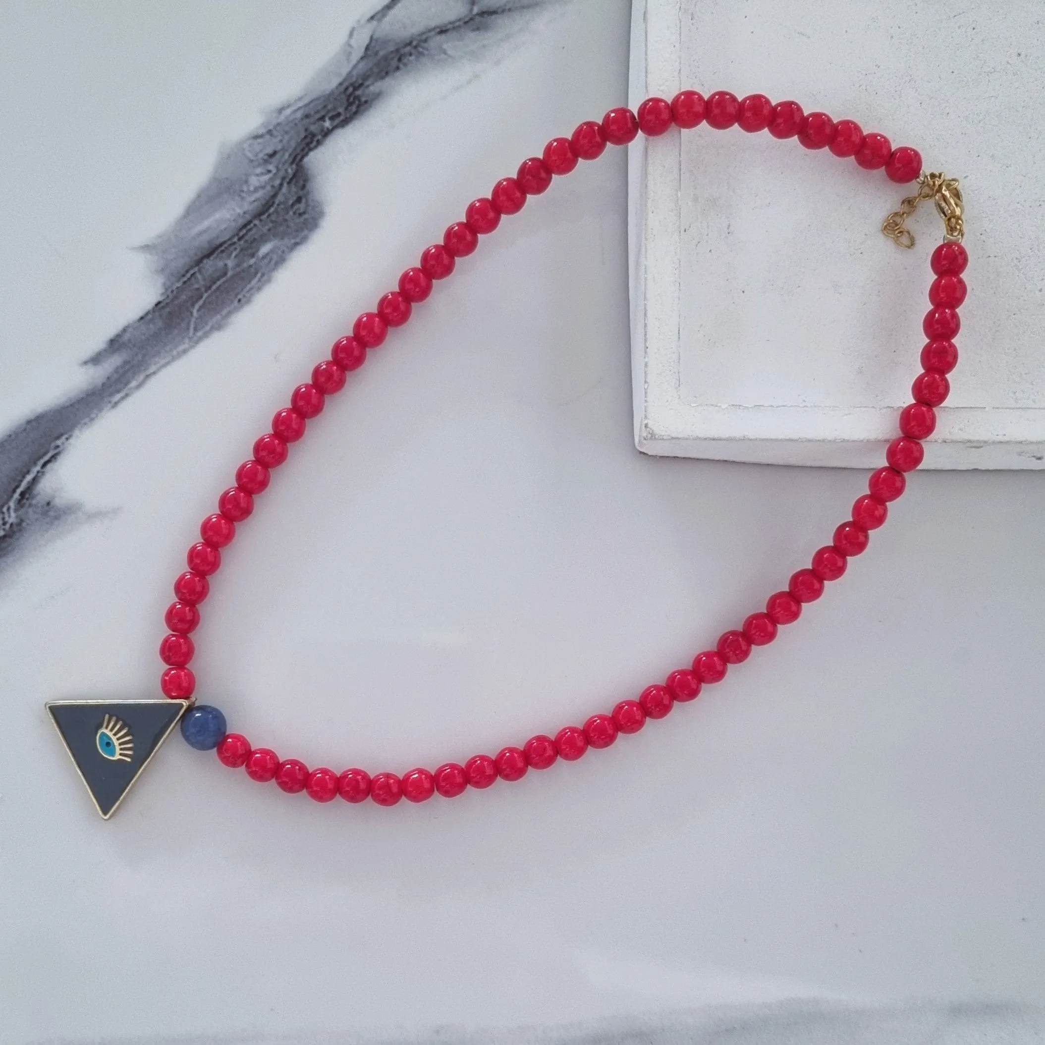 Evil eye/red howlites necklace