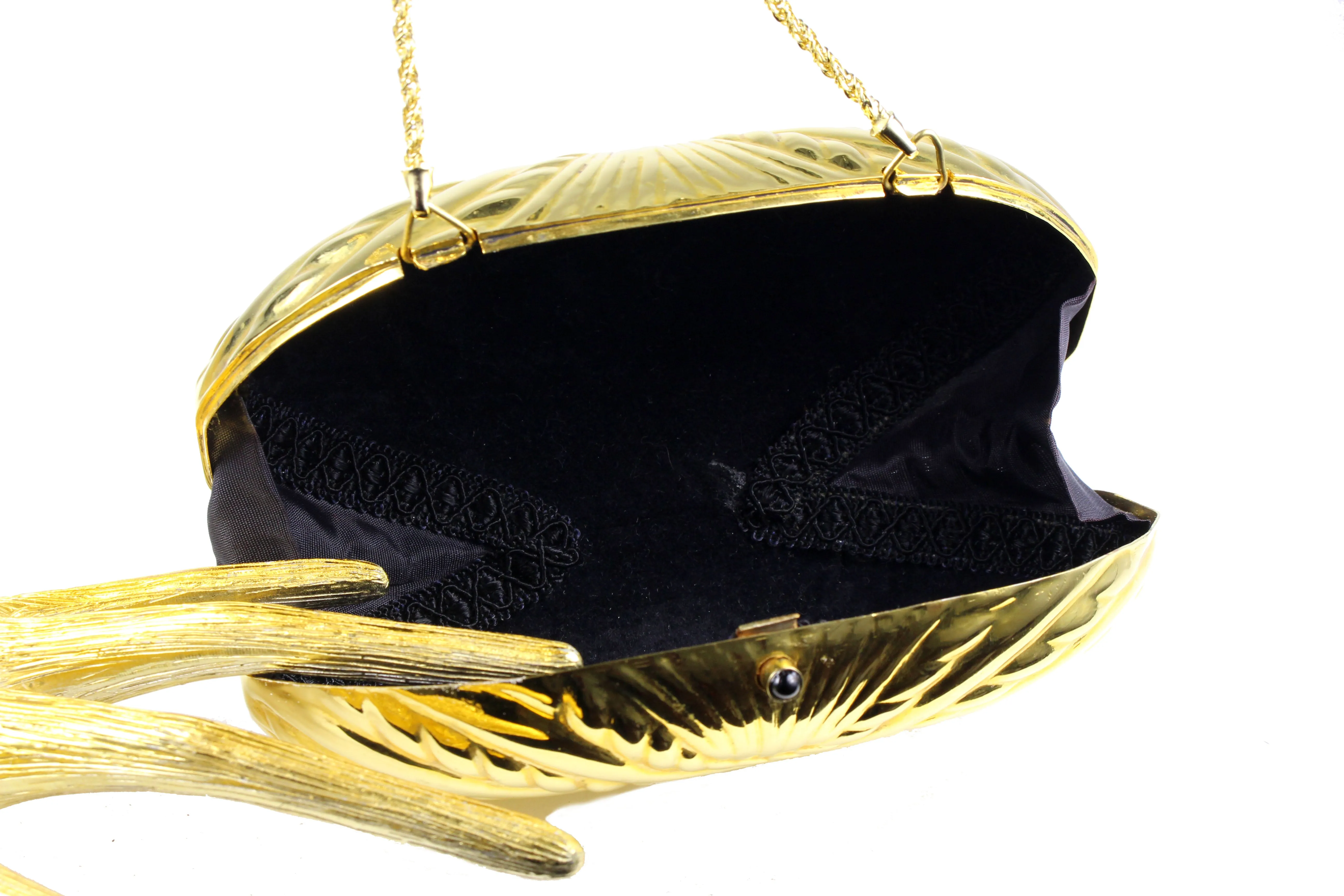 Golden metal oval-shaped clutch