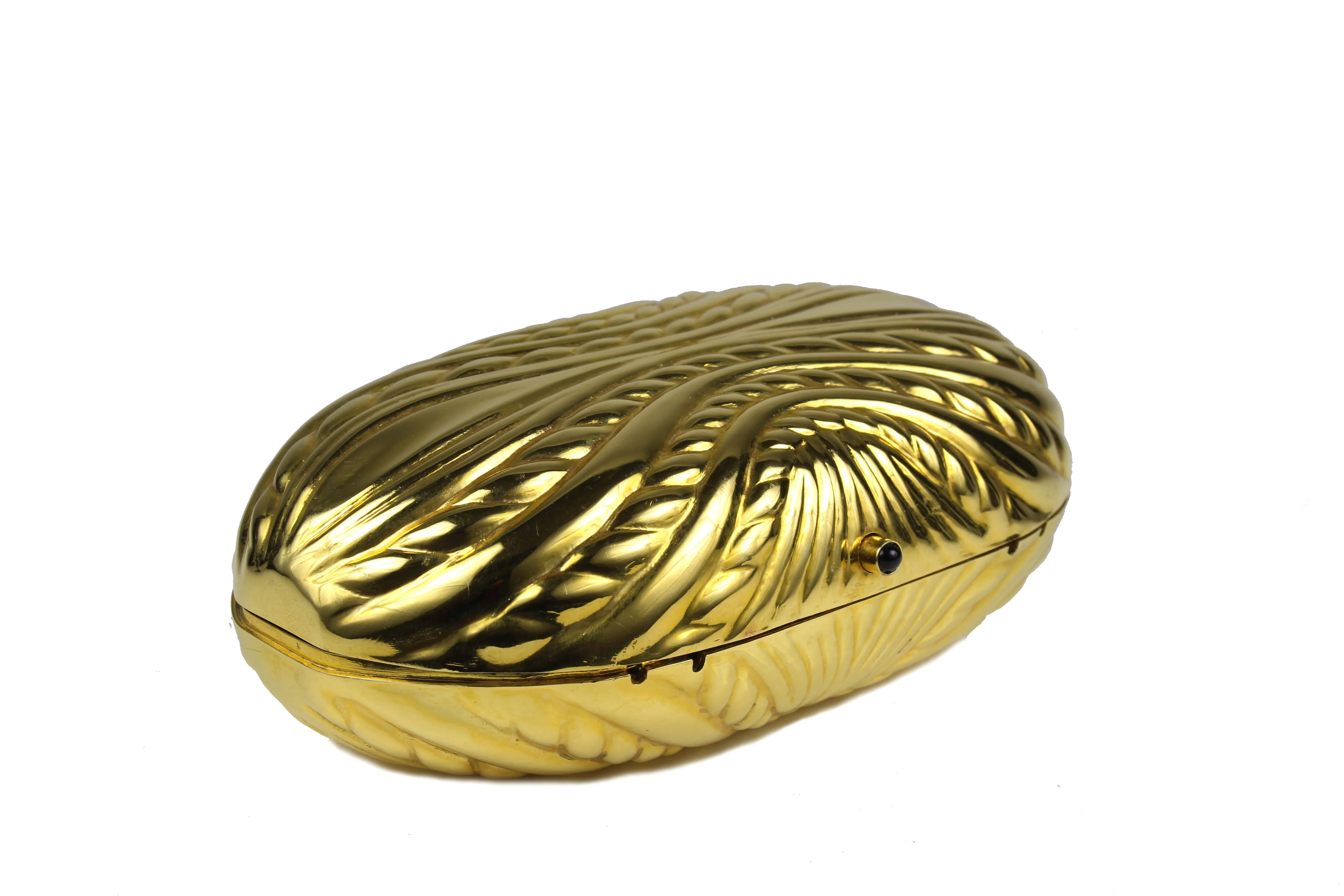 Golden metal oval-shaped clutch